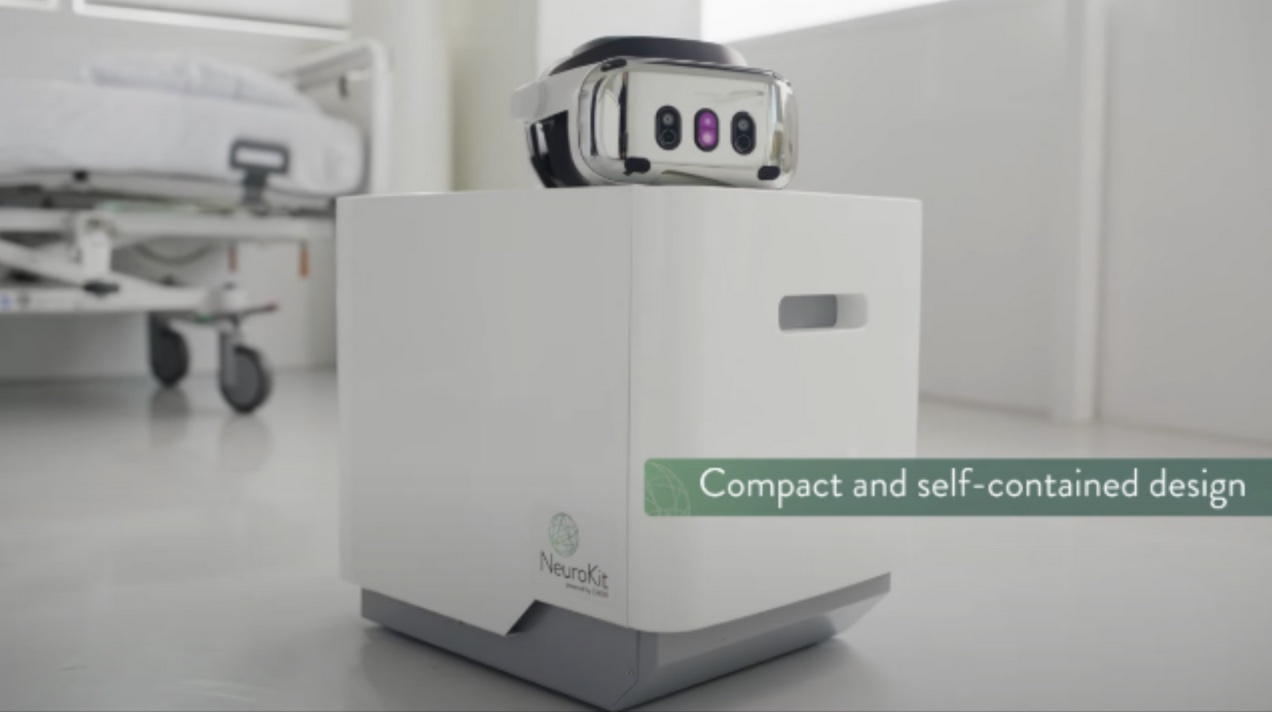 The NeuroKit, a compact white unit with a Varjo XR-4 headset resting on top, in a clinical room